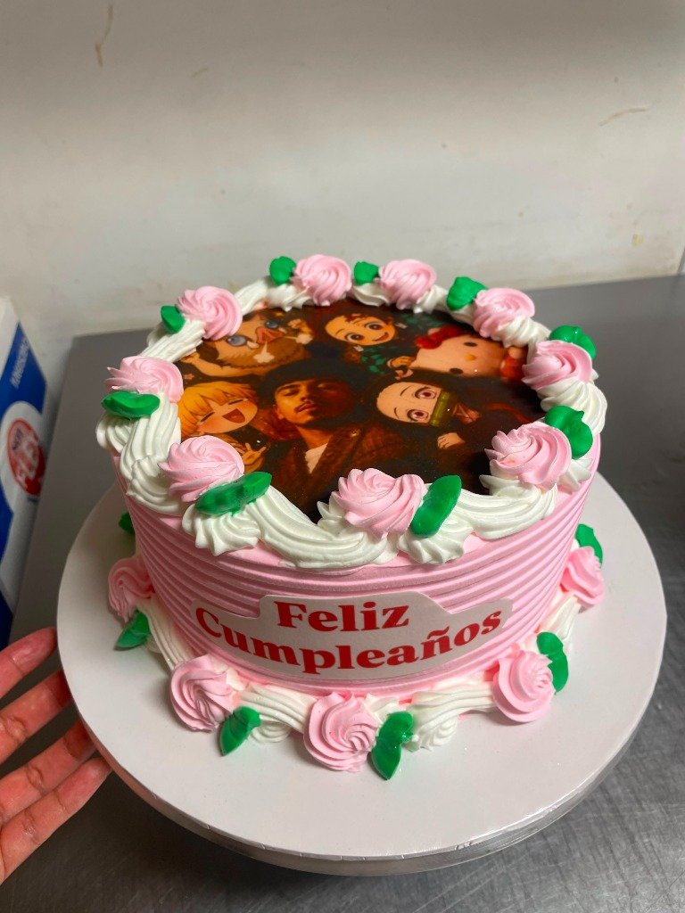 Pink themed cartoon custom birthday cake in Orange NJ